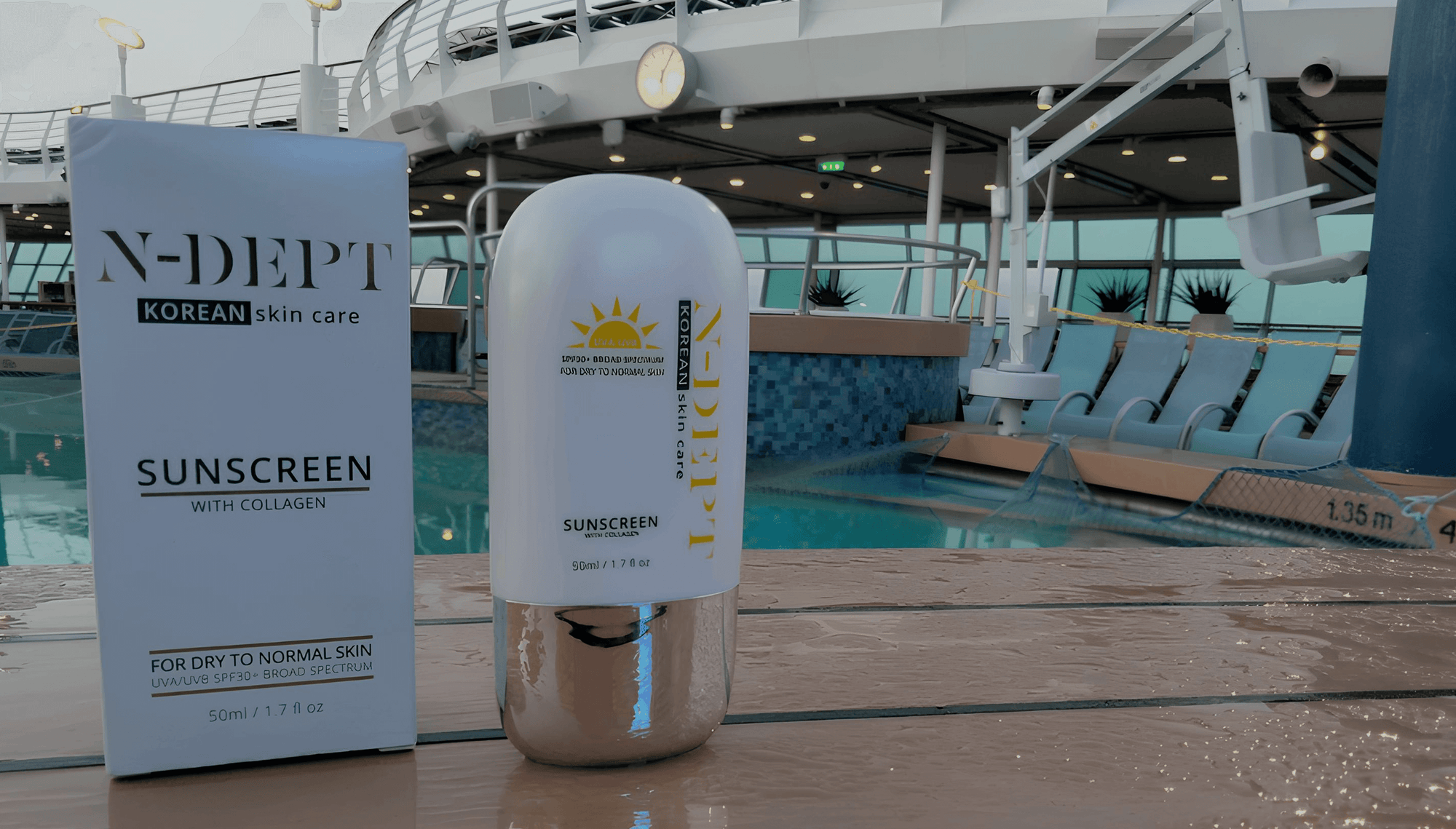 N-DEPT sunscreen bottle and packaging on a cruise ship deck.